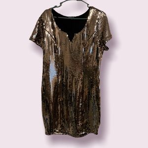 Perfect for New Years Eve, black gold short sleeve, knee length dress